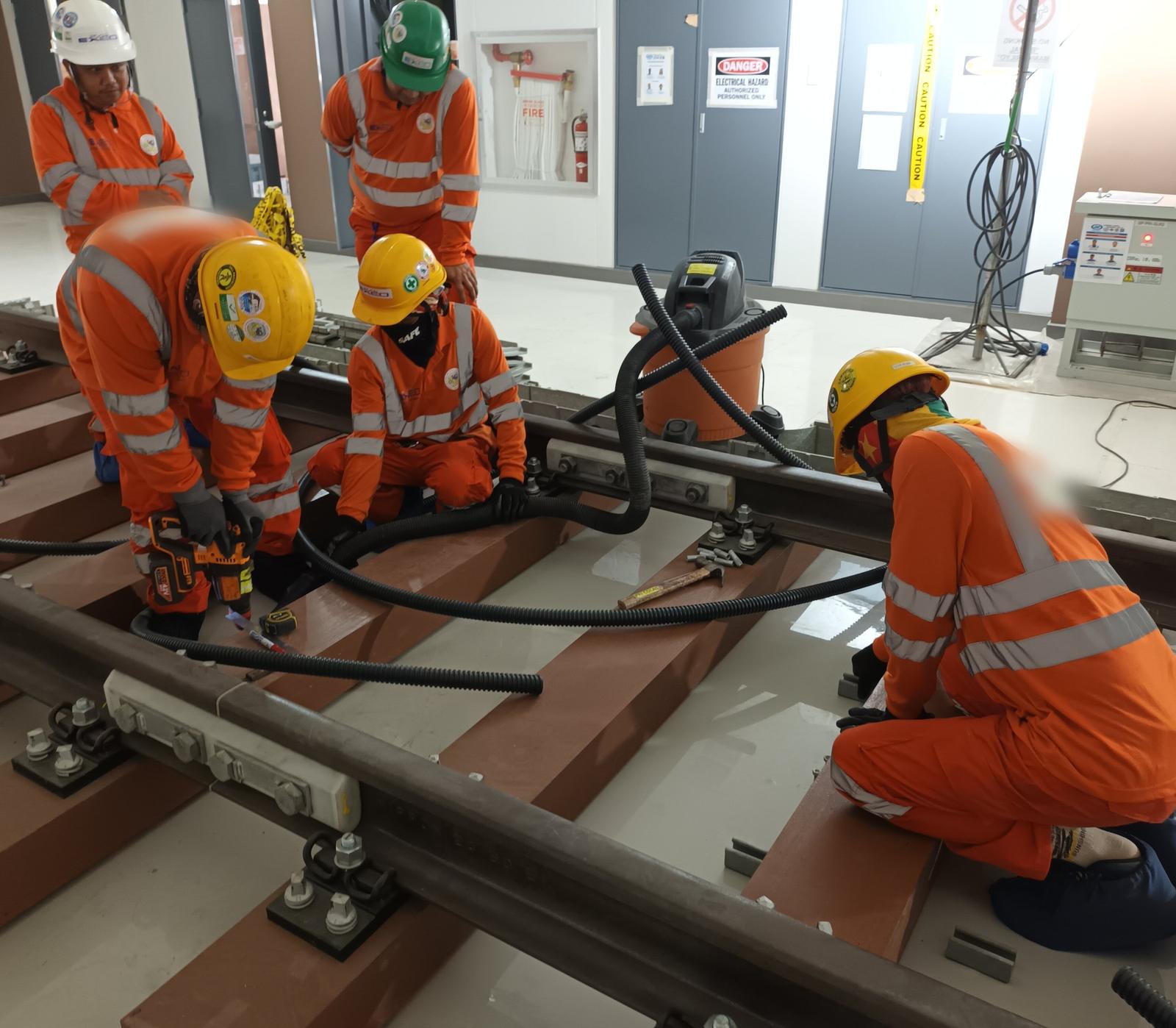 MG EXEO crew installing railway signaling equipment